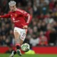 Pemain Manchester United, Alejandro Garnacho mencetak gol ke gawang Barnsley pada laga Carabao Cup 2024/2025 di Old Trafford, Manchester, Inggris, Rabu (18/09/2024) WIB. (AFP/Paul Ellis)